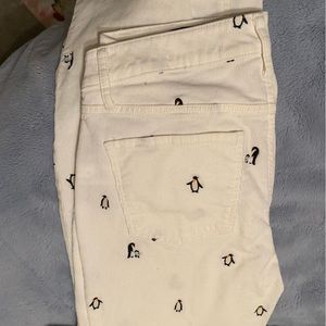 Cream colored Cordaroy pants with penguins on them, super cute.